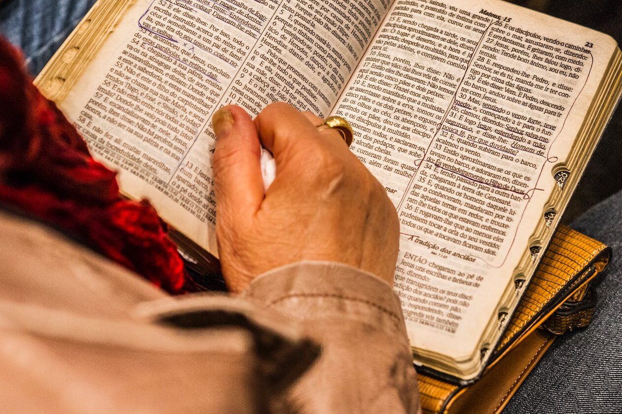 person holding Scripture